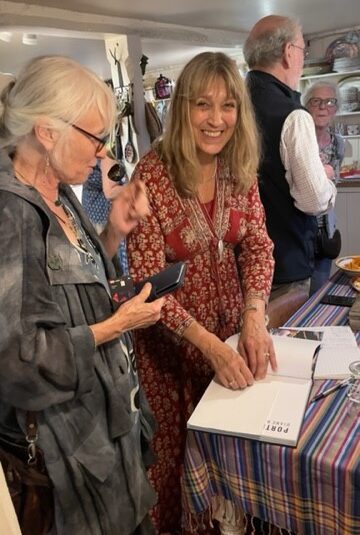 Diane Barker signing a copy of PORTRAITS OF TIBET